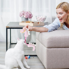 cat and girl playing cat stick toy plush