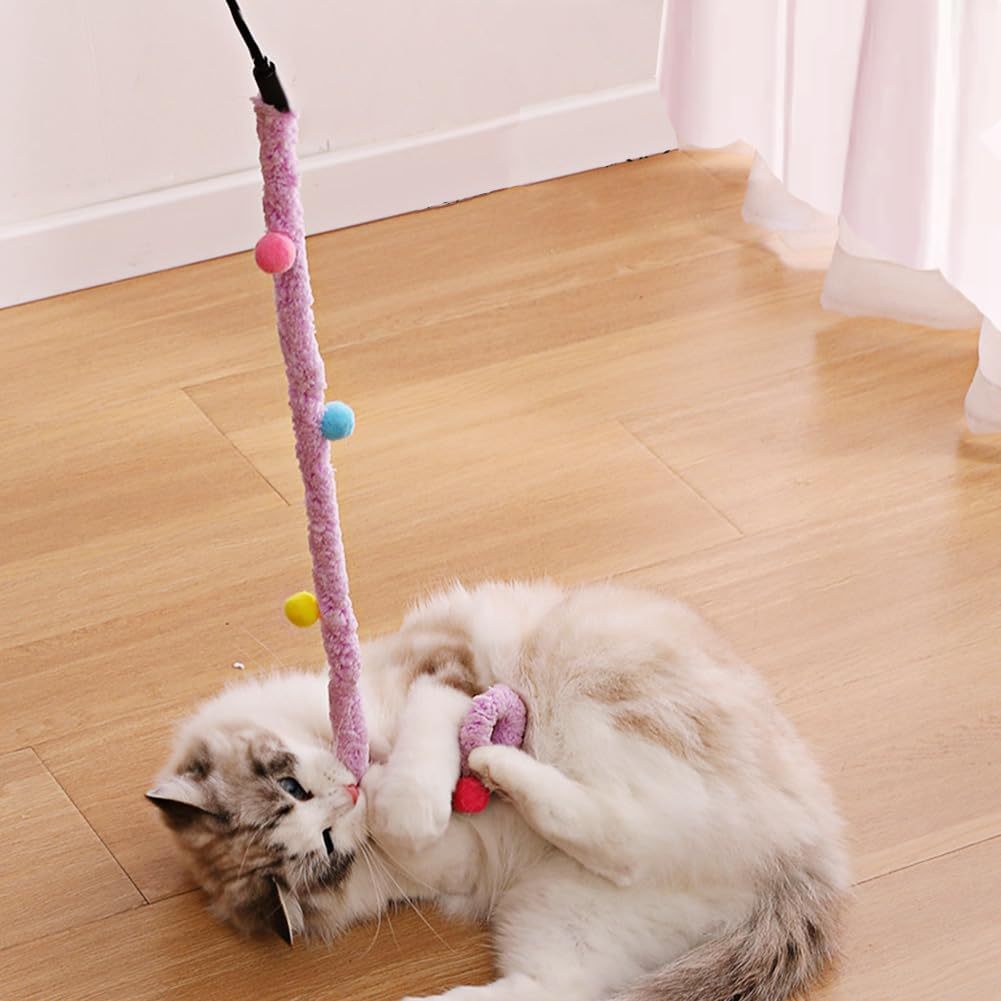 cat playing with pom pom stick